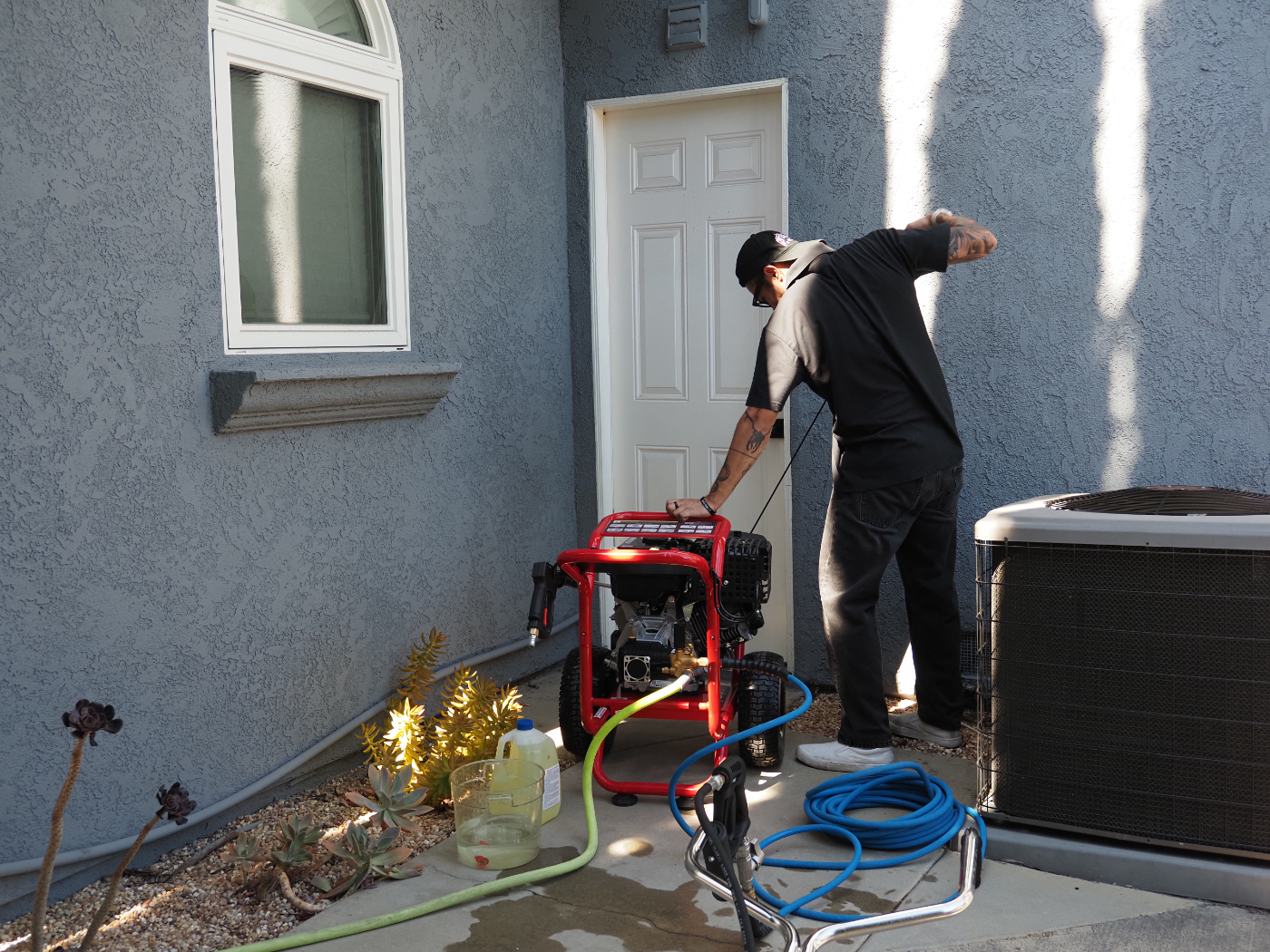 Dylan setting up the pressure washer on site